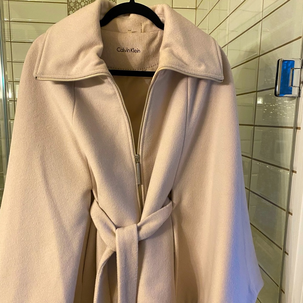 Cream colored cape jacket with belt ..